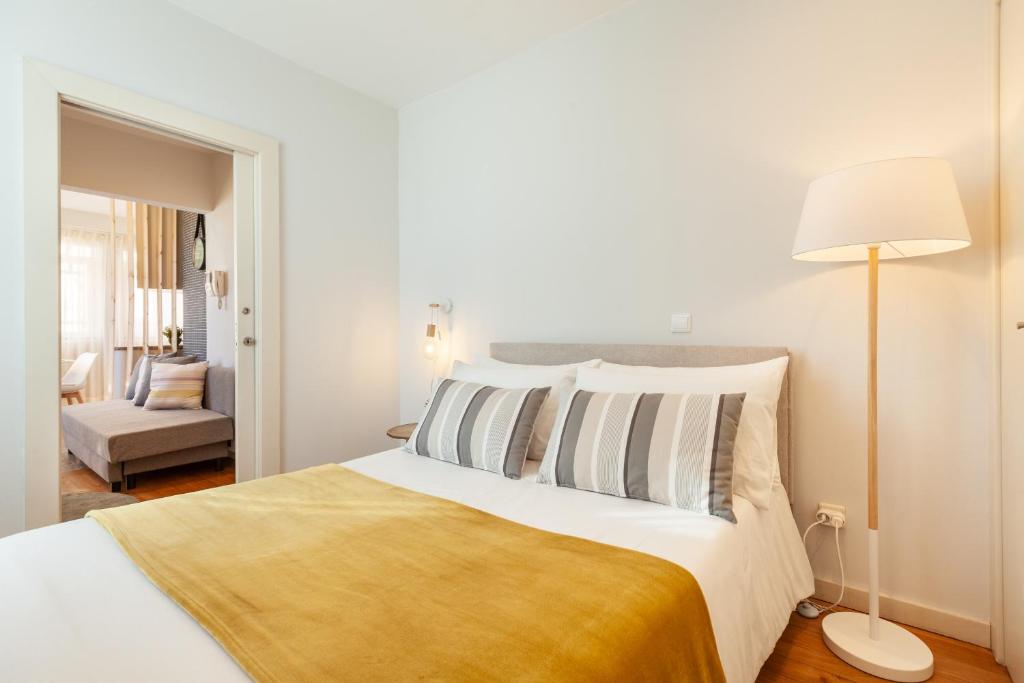 Postel nebo postele na pokoji v ubytování D&S - Ribeira Premium Apartments