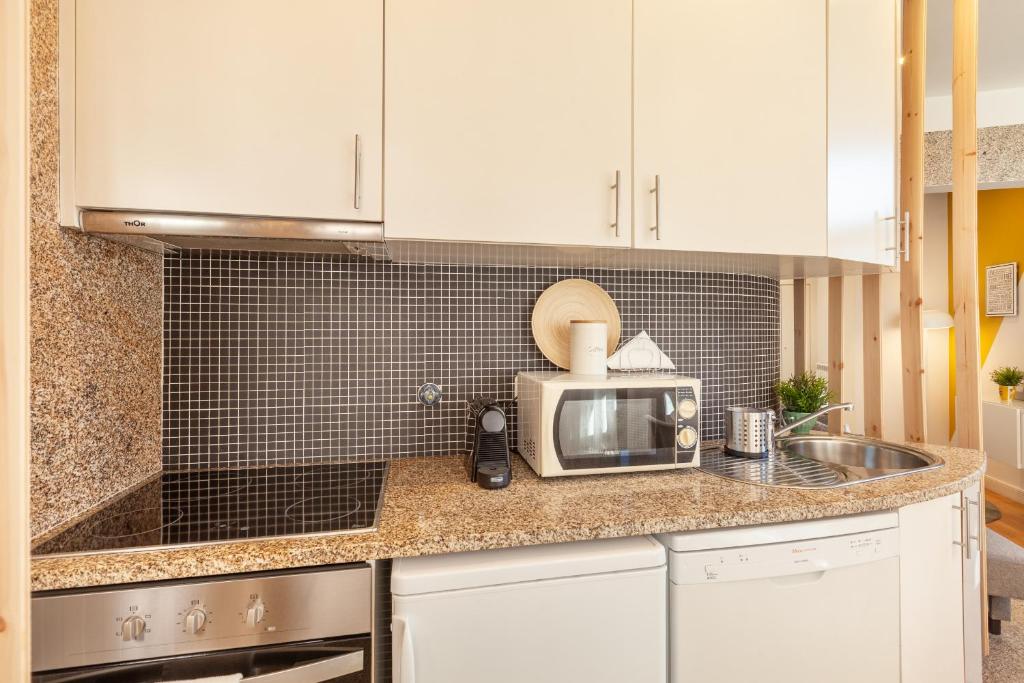 Kuchyň nebo kuchyňský kout v ubytování D&S - Ribeira Premium Apartments