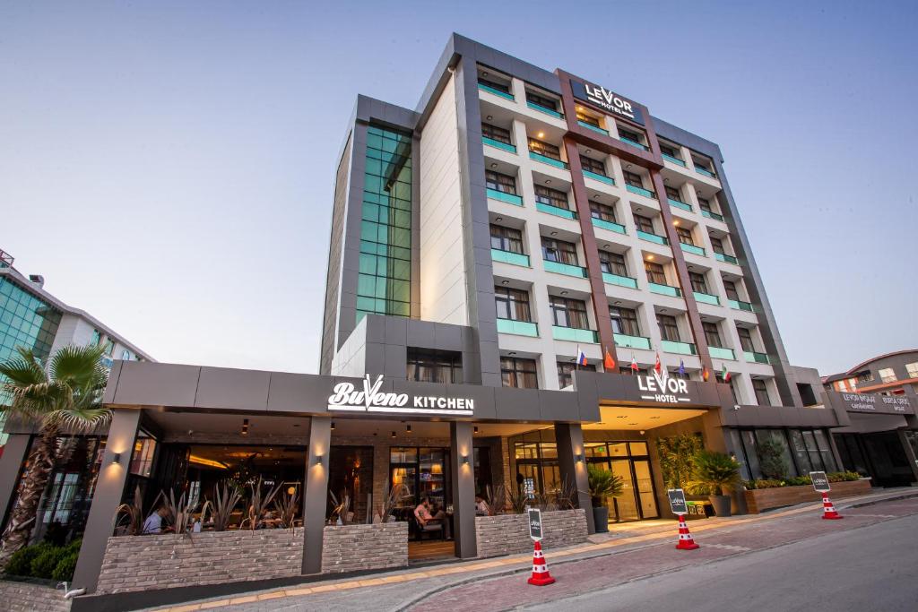 a building on a street with cones in front of it at Levor Hotel in Bursa