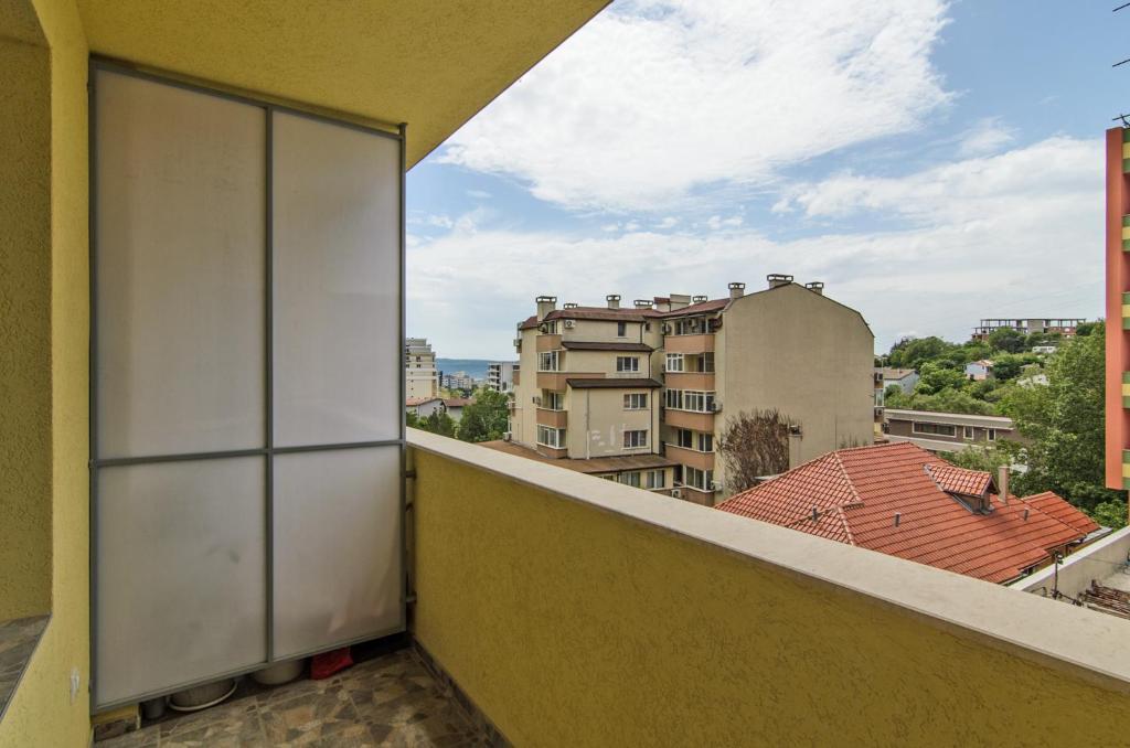 a balcony with a view of a city at Apartment Sanik in Varna City
