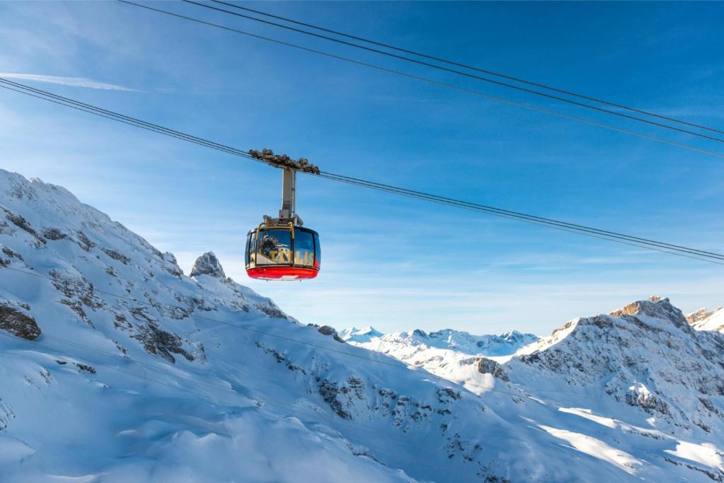 a ski lift over a snow covered mountain at Hotel Sonnwendhof Engelberg in Engelberg