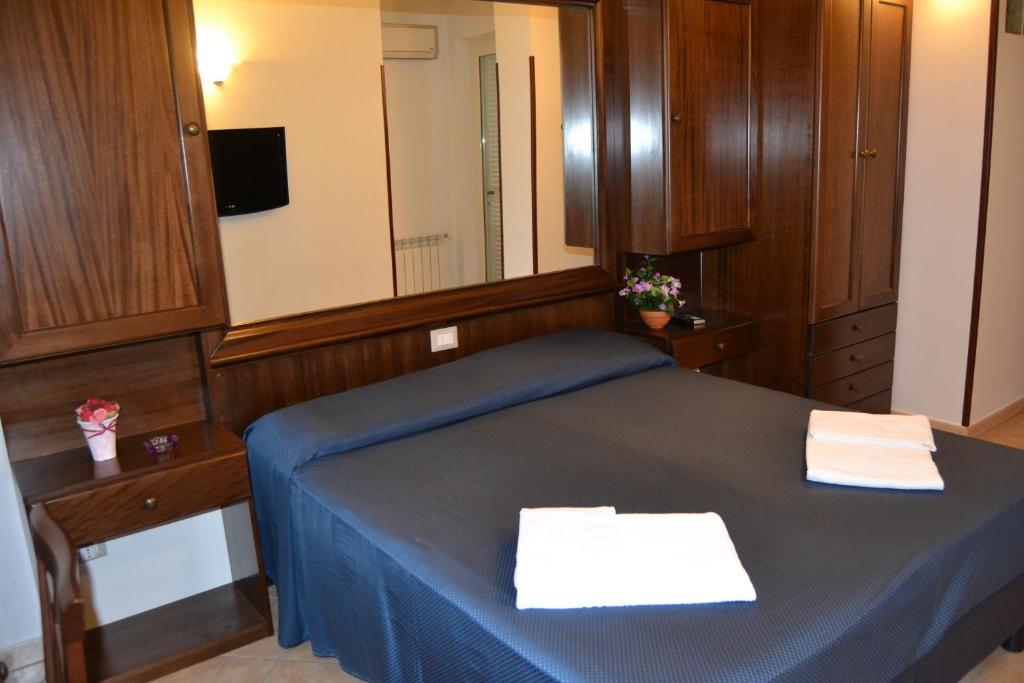 Postel nebo postele na pokoji v ubytování Affittacamere Stranamore