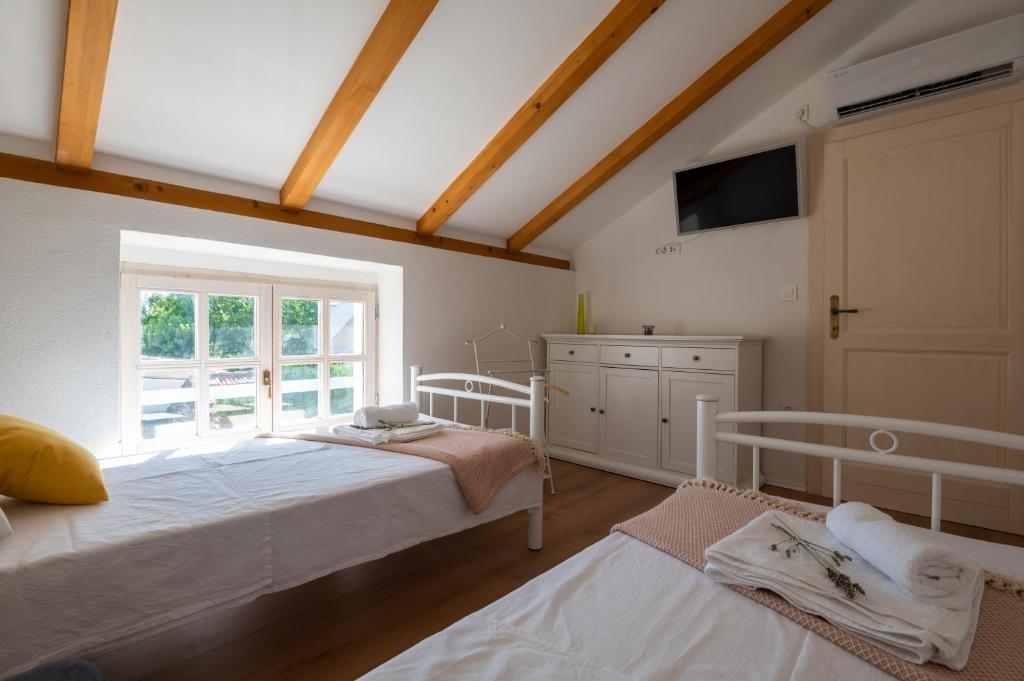 Posteľ alebo postele v izbe v ubytovaní Villa Perliano