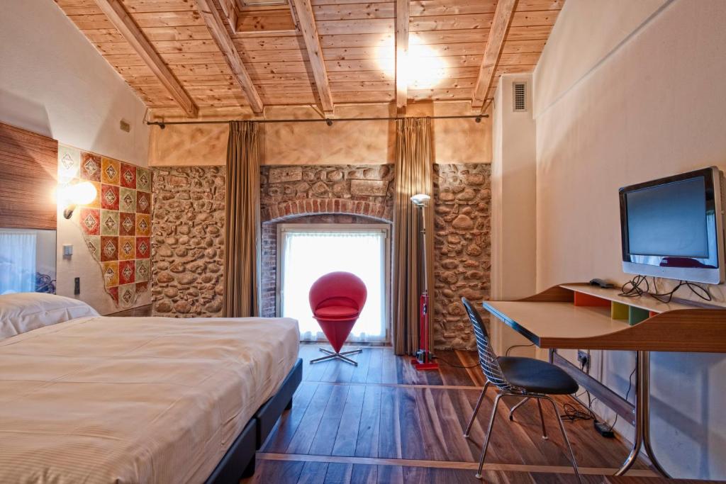 Postel nebo postele na pokoji v ubytování Hotel Veronesi La Torre