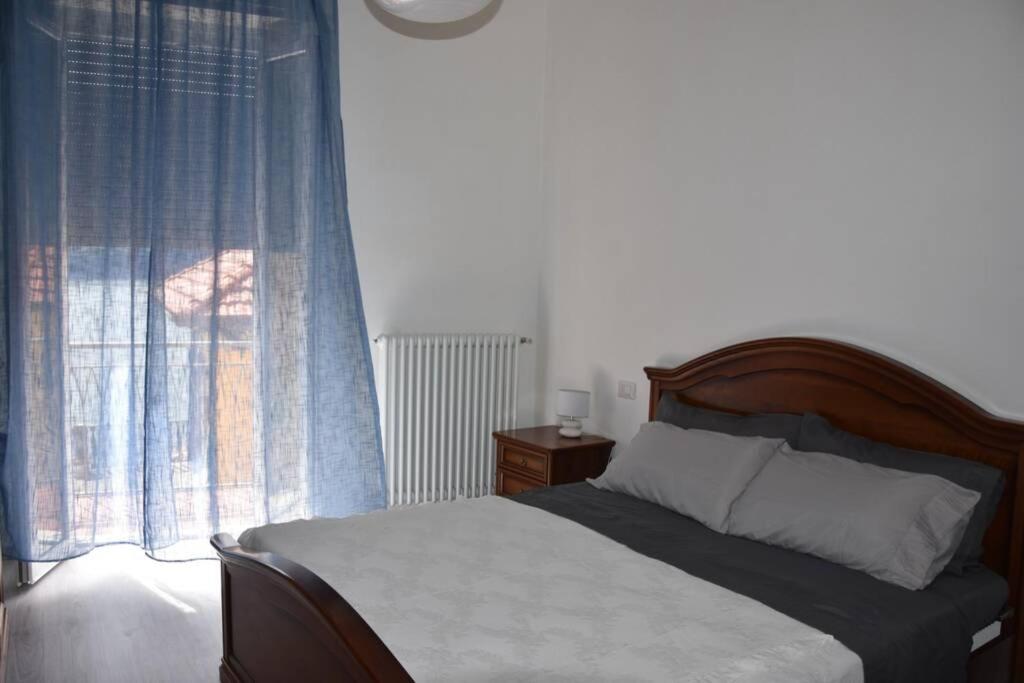 Postel nebo postele na pokoji v ubytování La Resilienza, apartment with view, Carate Urio