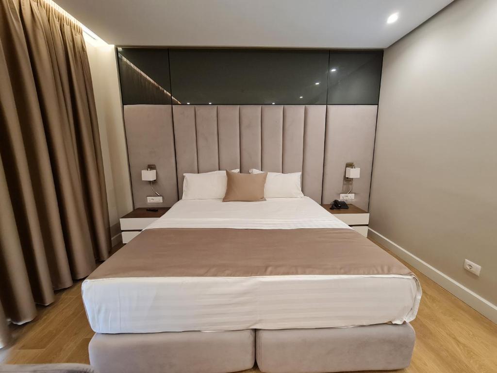Postel nebo postele na pokoji v ubytování Hotel Aross