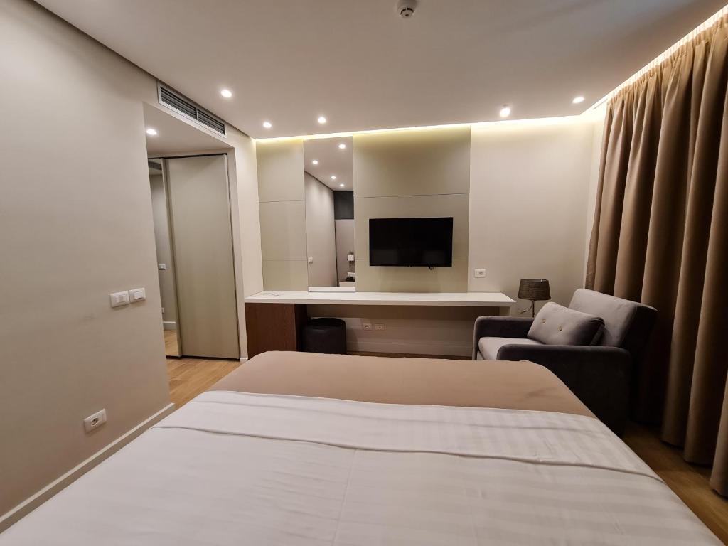 Postel nebo postele na pokoji v ubytování Hotel Aross