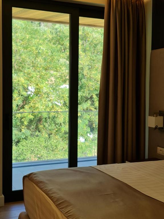 Postel nebo postele na pokoji v ubytování Hotel Aross