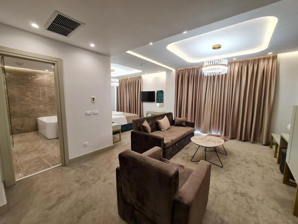 TV a/nebo společenská místnost v ubytování Hotel Aross