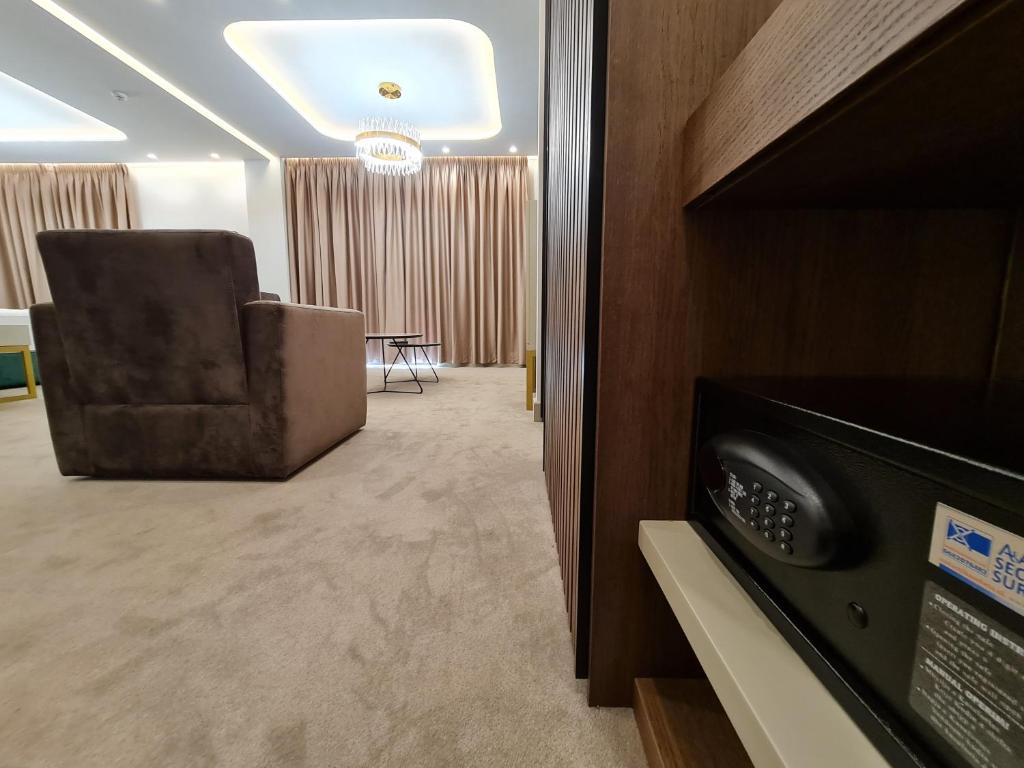 TV a/nebo společenská místnost v ubytování Hotel Aross