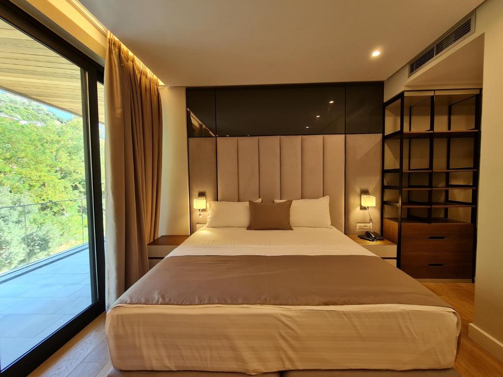 Postel nebo postele na pokoji v ubytování Hotel Aross