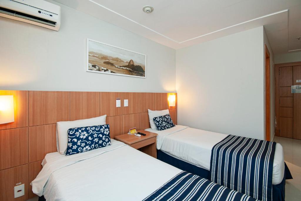 Postel nebo postele na pokoji v ubytování Hotel Atlântico Rio