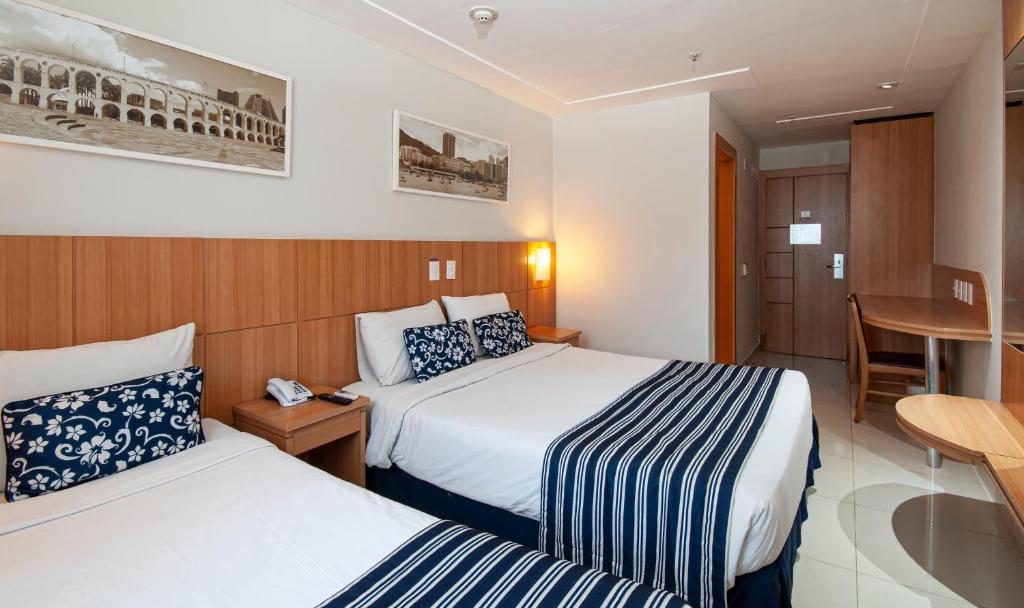 Postel nebo postele na pokoji v ubytování Hotel Atlântico Rio