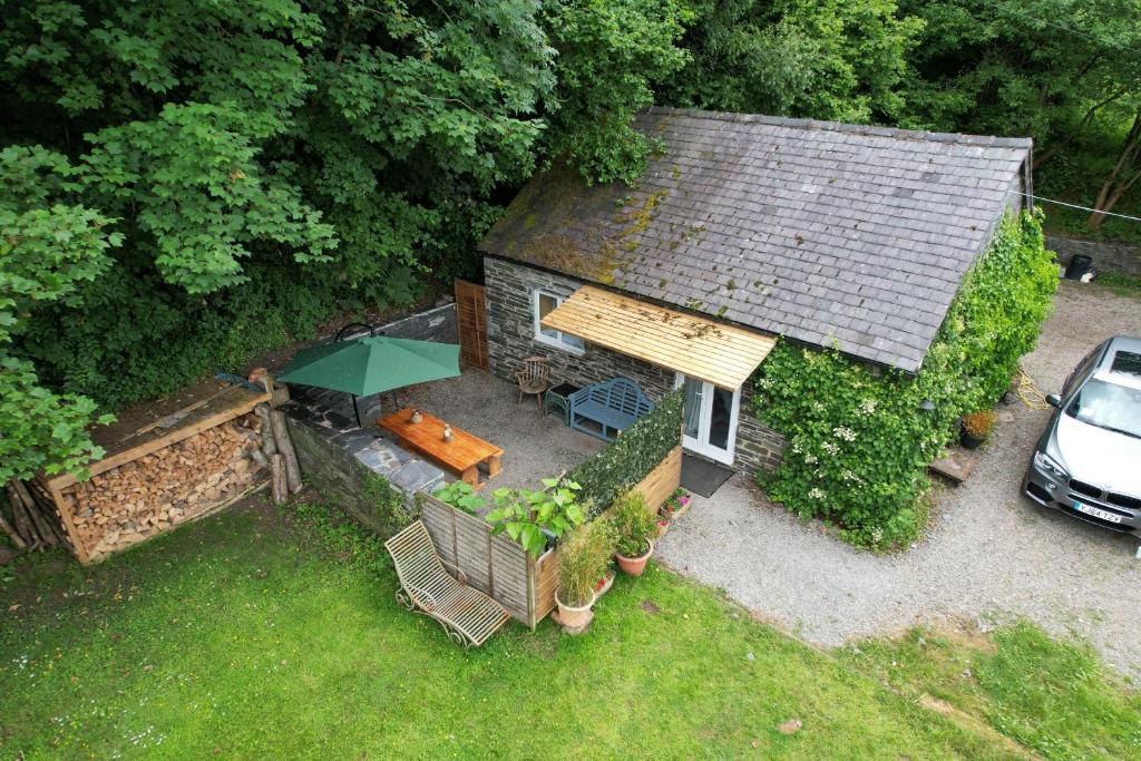 an aerial view of a house with a table and chairs at Milkwood Cottage in Corwen
