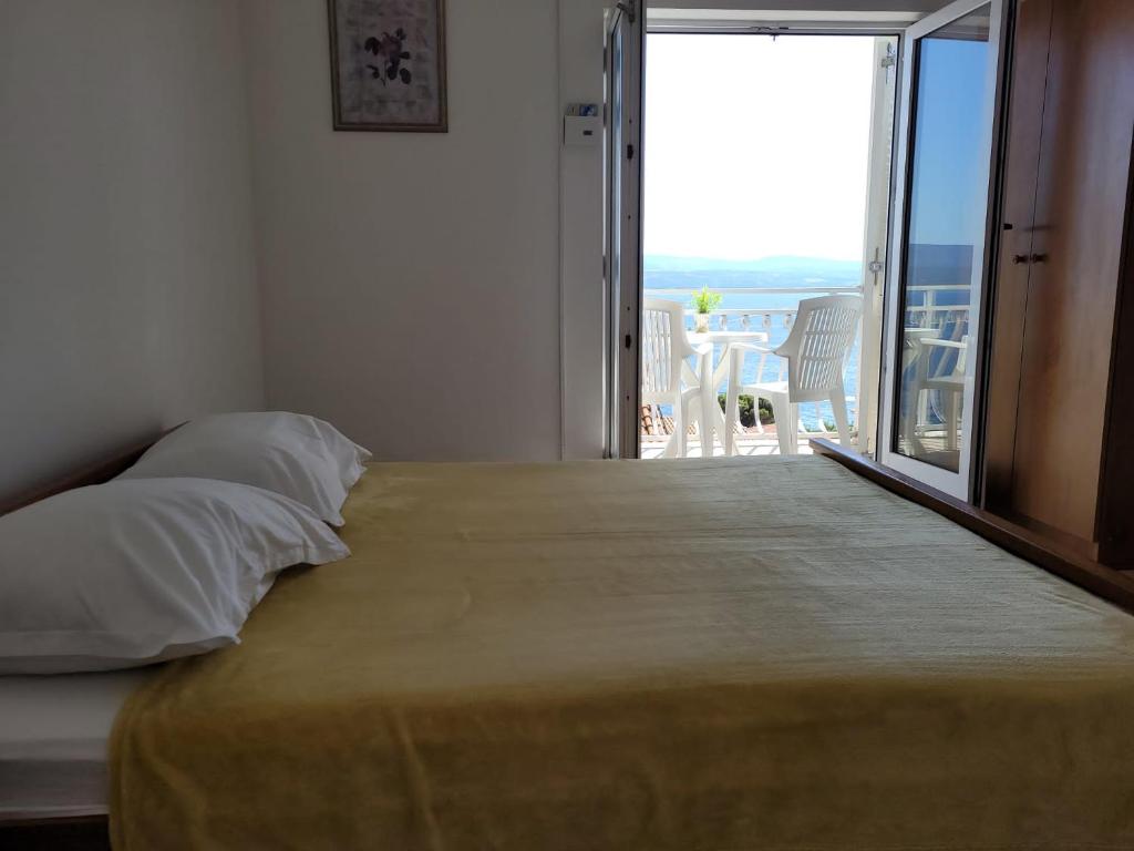 Postel nebo postele na pokoji v ubytování Anic Apartments Stanići