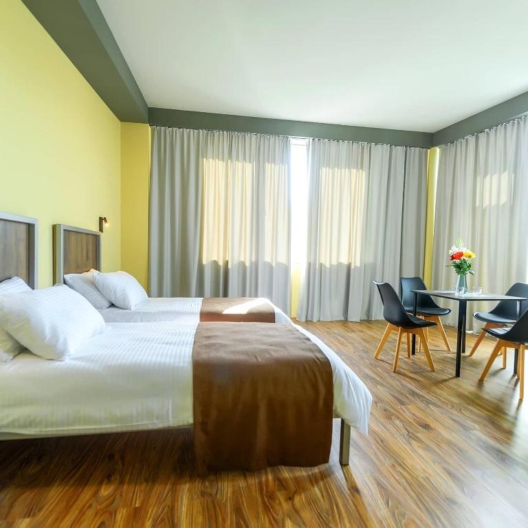 Postel nebo postele na pokoji v ubytování STARK HOTEL