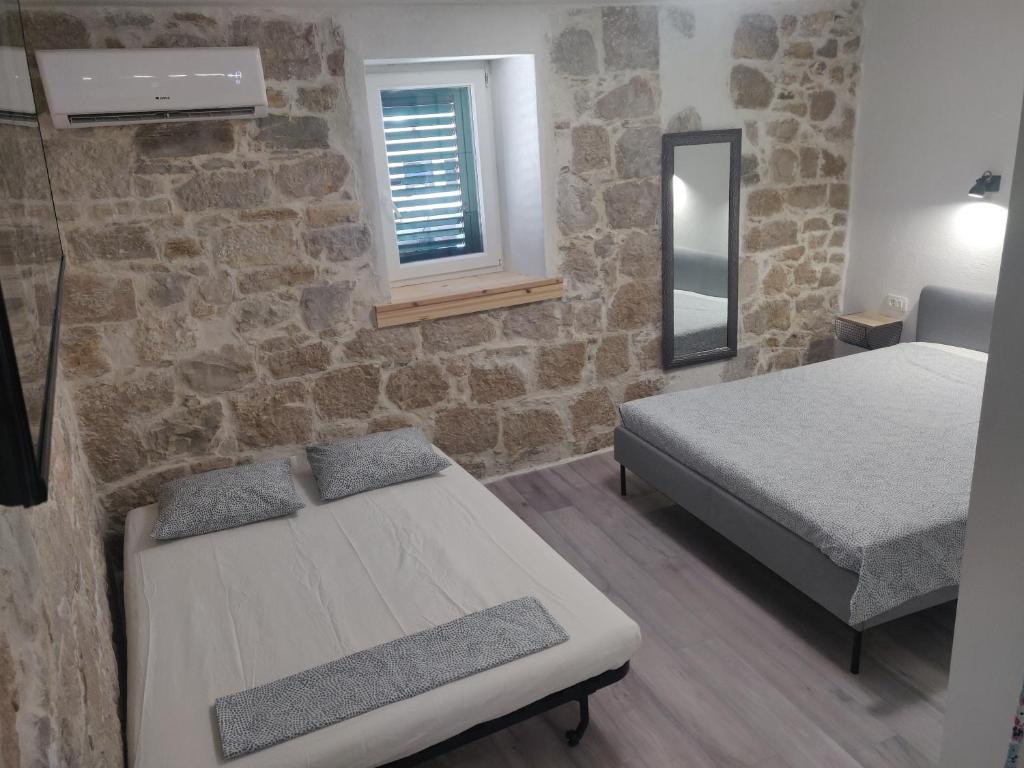 Postel nebo postele na pokoji v ubytování Split Stone