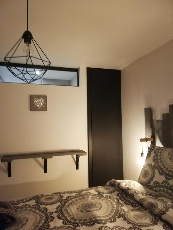 Postel nebo postele na pokoji v ubytování La casa d'Ernestine
