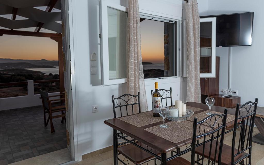 A television and/or entertainment centre at Apartments Kalaitzakis with private pool