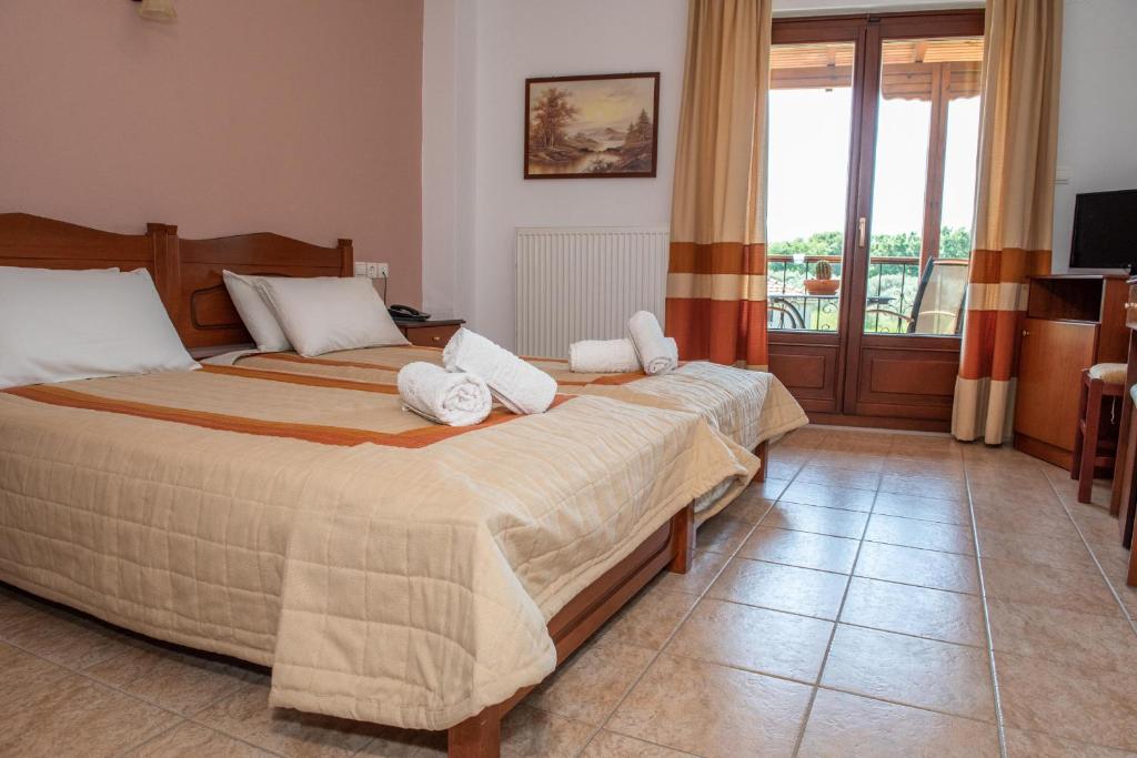 Posteľ alebo postele v izbe v ubytovaní Hotel Ainareti