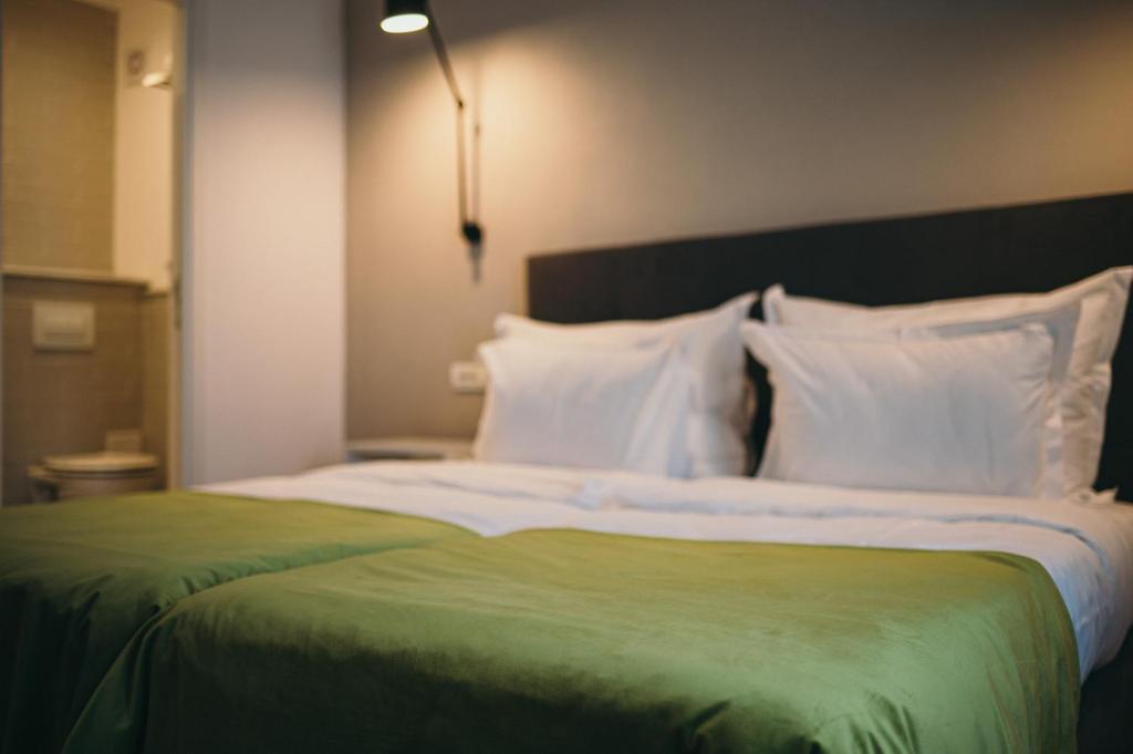 Postel nebo postele na pokoji v ubytování Nest Guesthouse