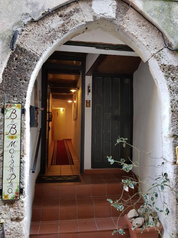 The facade or entrance of Maison Dina