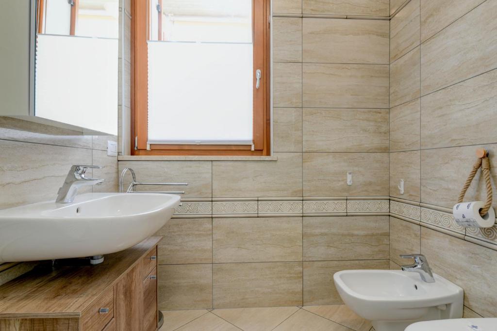 Kúpeľňa v ubytovaní Rosa del Lago Apartment