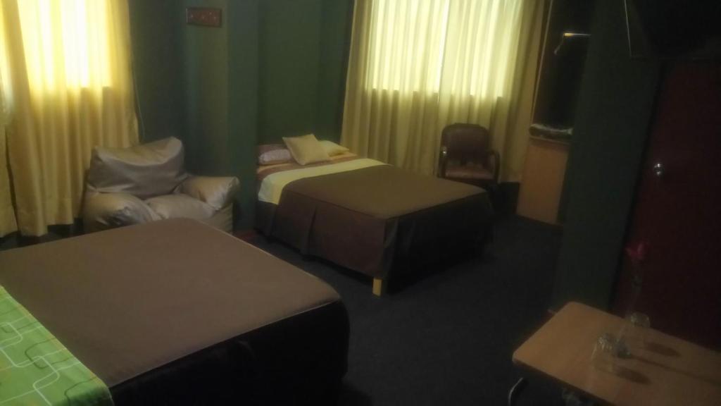 Postel nebo postele na pokoji v ubytování Hostal Residencial Mochica