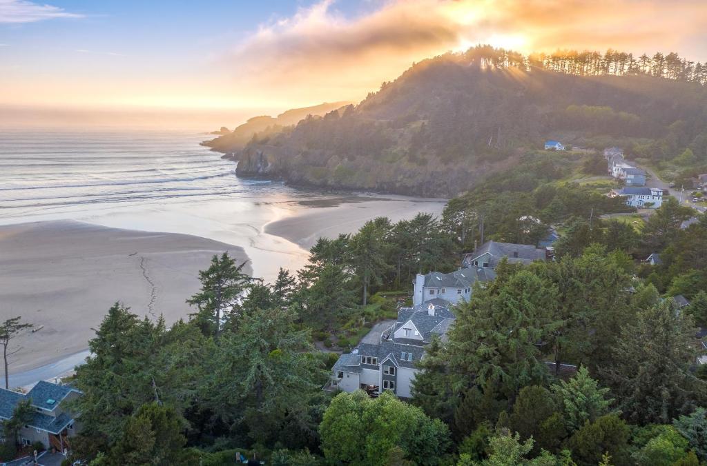 a house on a hill next to a beach at Ocean House in Newport