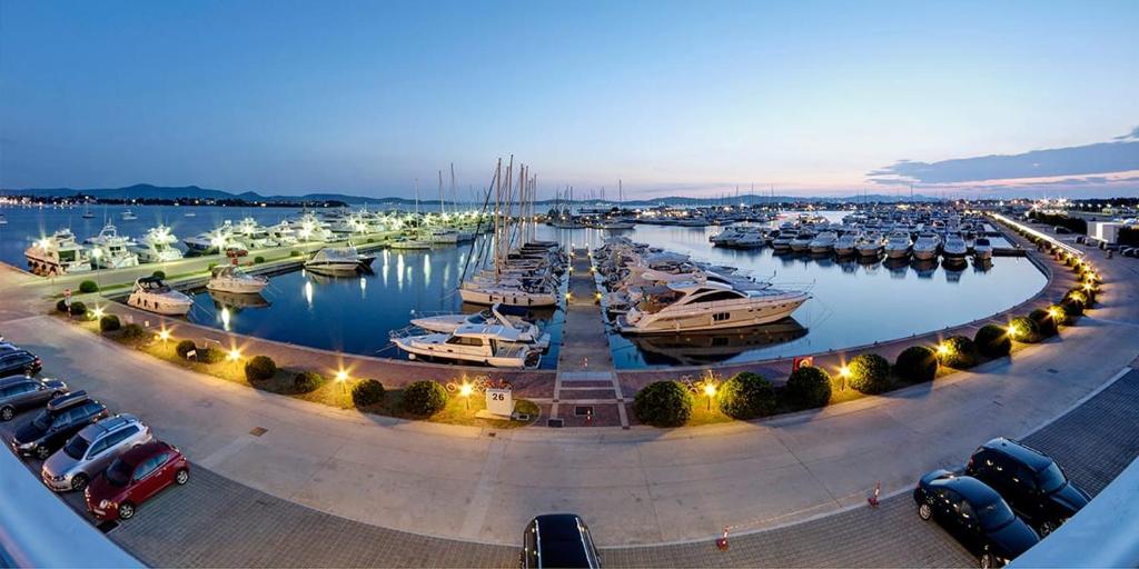 a marina filled with lots of boats in the water at Apartments Emanuela in Sukošan