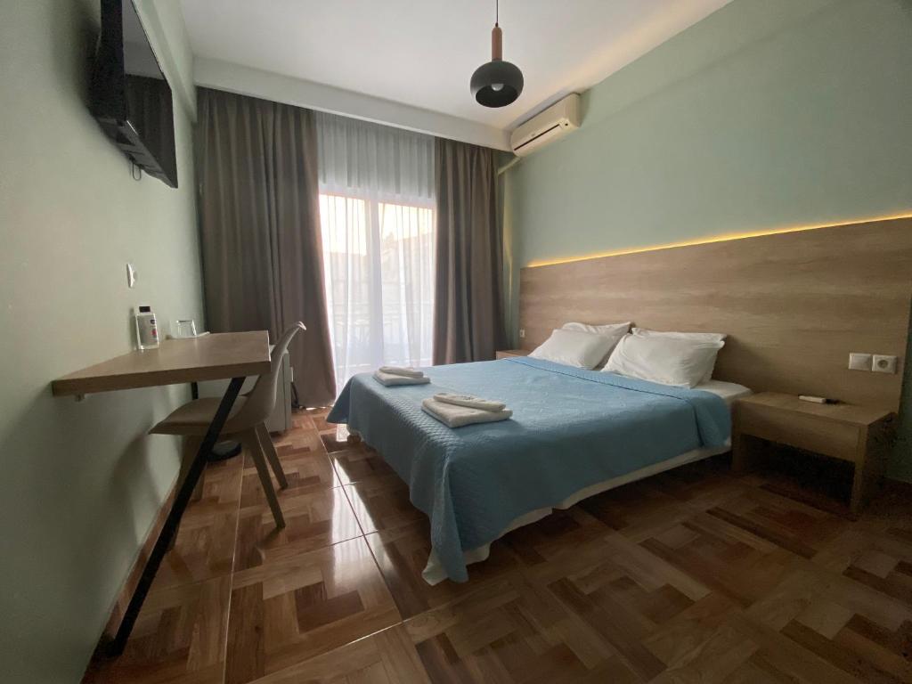 A bed or beds in a room at Moudania Mare Hotel