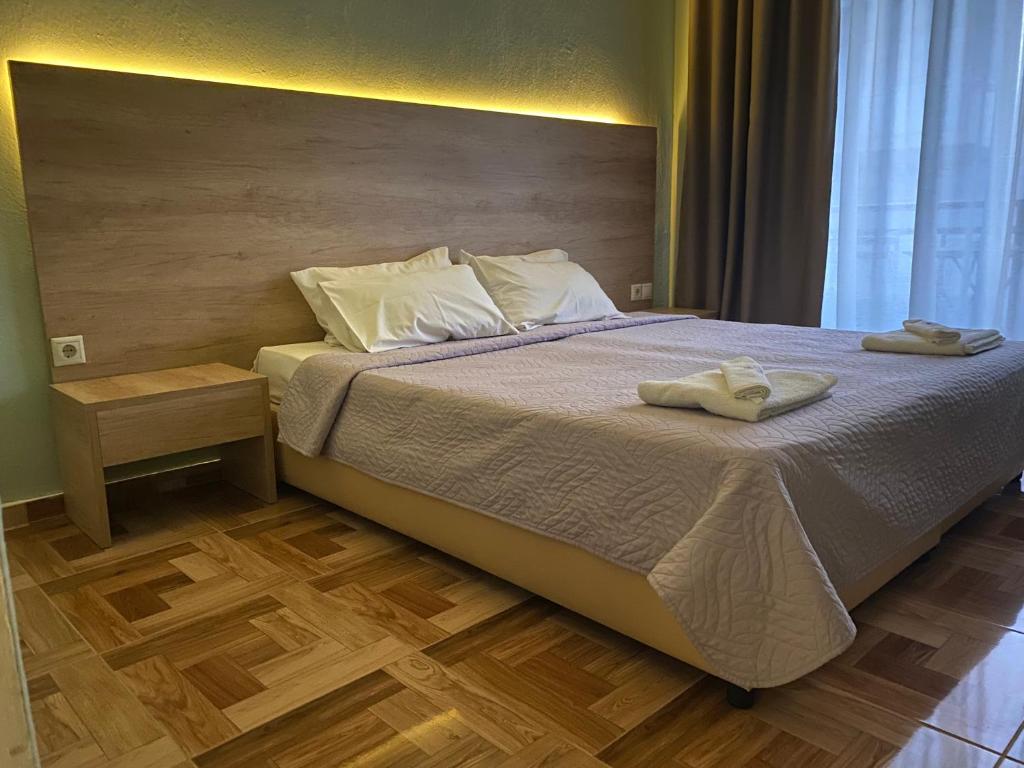 A bed or beds in a room at Moudania Mare Hotel