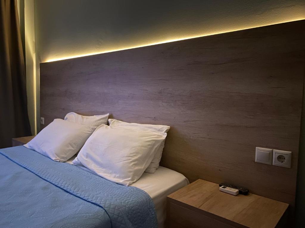 A bed or beds in a room at Moudania Mare Hotel