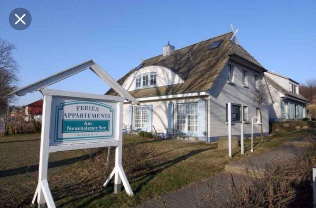 a sign in front of a house at Apartment in Sellin/Insel Rügen 37917 in Sandort