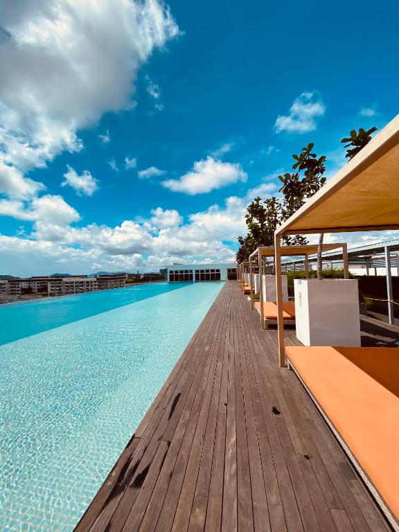 a swimming pool on the roof of a building at JY Vacation Home New & Modern Suite Infinity pool-Sutera Avenue in Kota Kinabalu