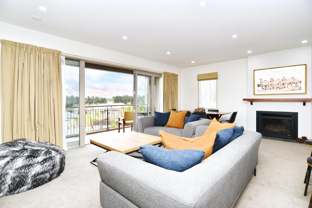 a living room with a couch and a fireplace at High Country Villa 250 - Terrace Downs in Windwhistle