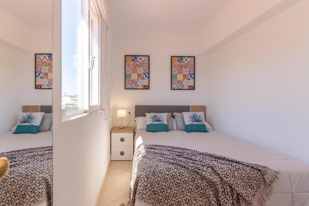 Postel nebo postele na pokoji v ubytování Pondarosa Penthouse 55 - Costa CarpeDiem