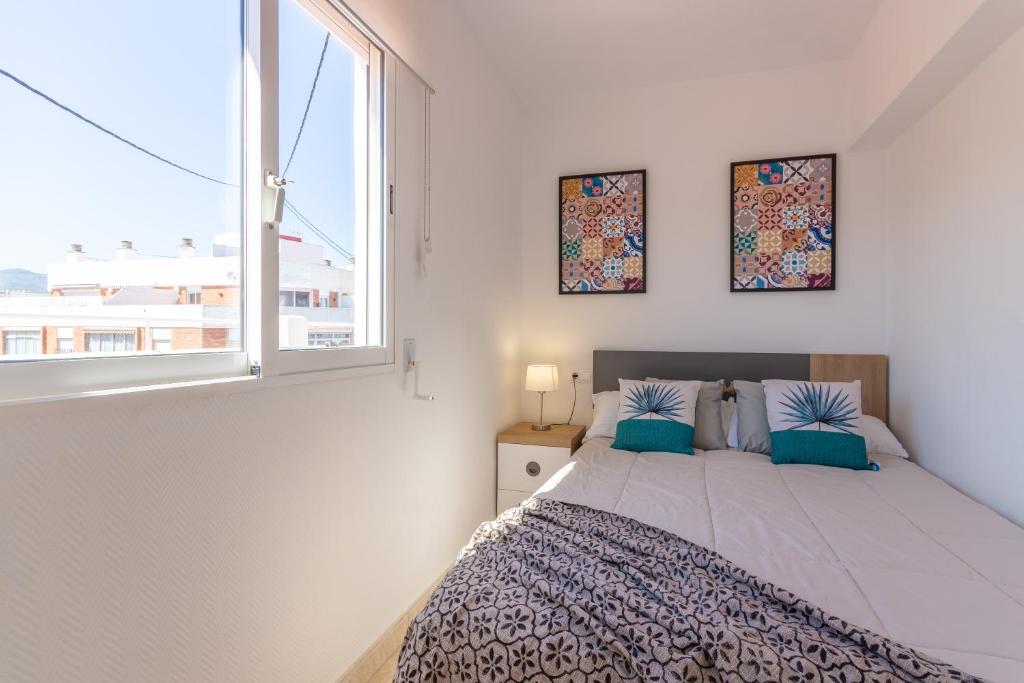 Postel nebo postele na pokoji v ubytování Pondarosa Penthouse 55 - Costa CarpeDiem
