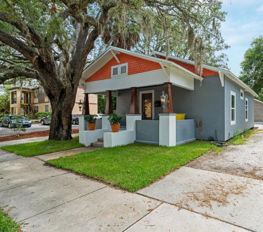 a small house with an orange roof at Hibiscus Hideaway in Tarpon Springs