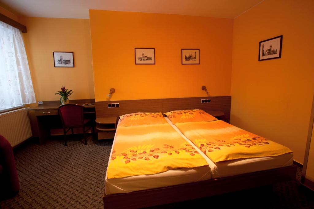 Postel nebo postele na pokoji v ubytování Hotel U Jiřího