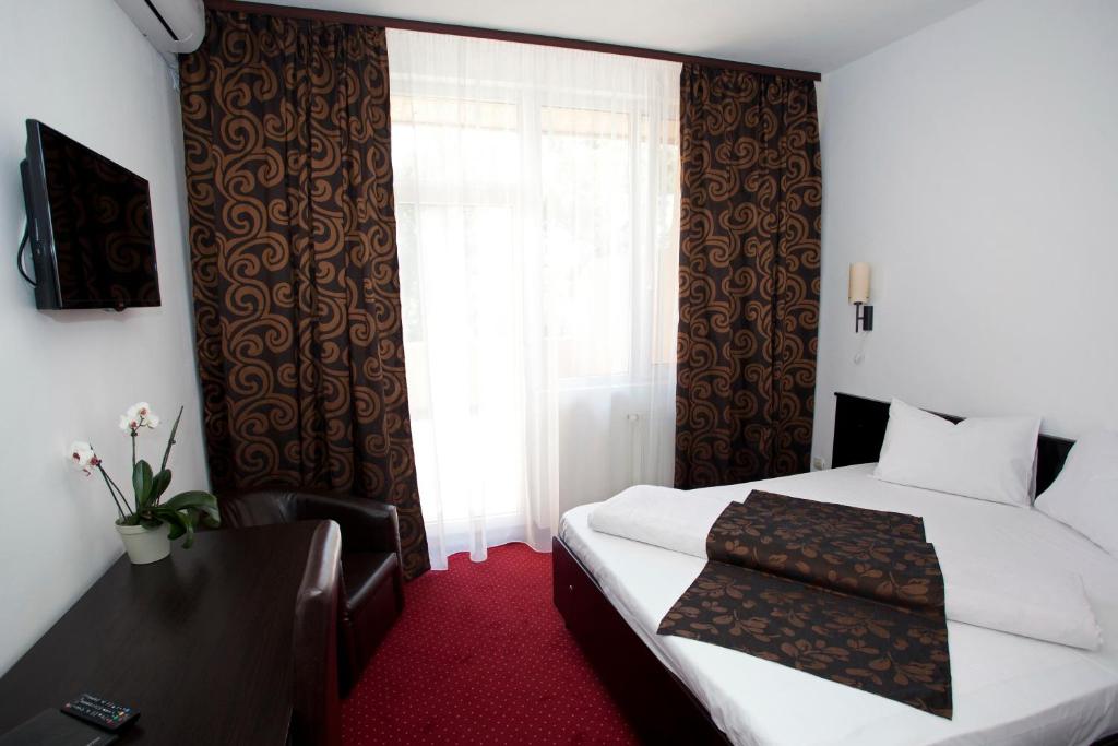 Postel nebo postele na pokoji v ubytování Hotel Terra