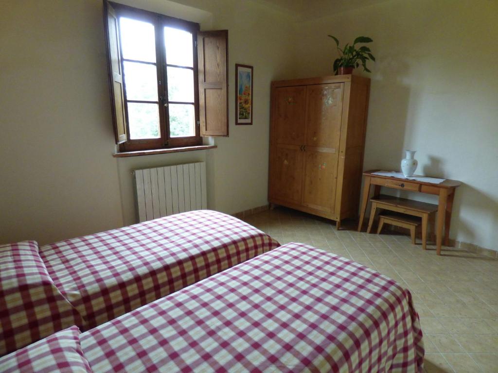 Posteľ alebo postele v izbe v ubytovaní Peaceful Farm Stay in the Tuscany