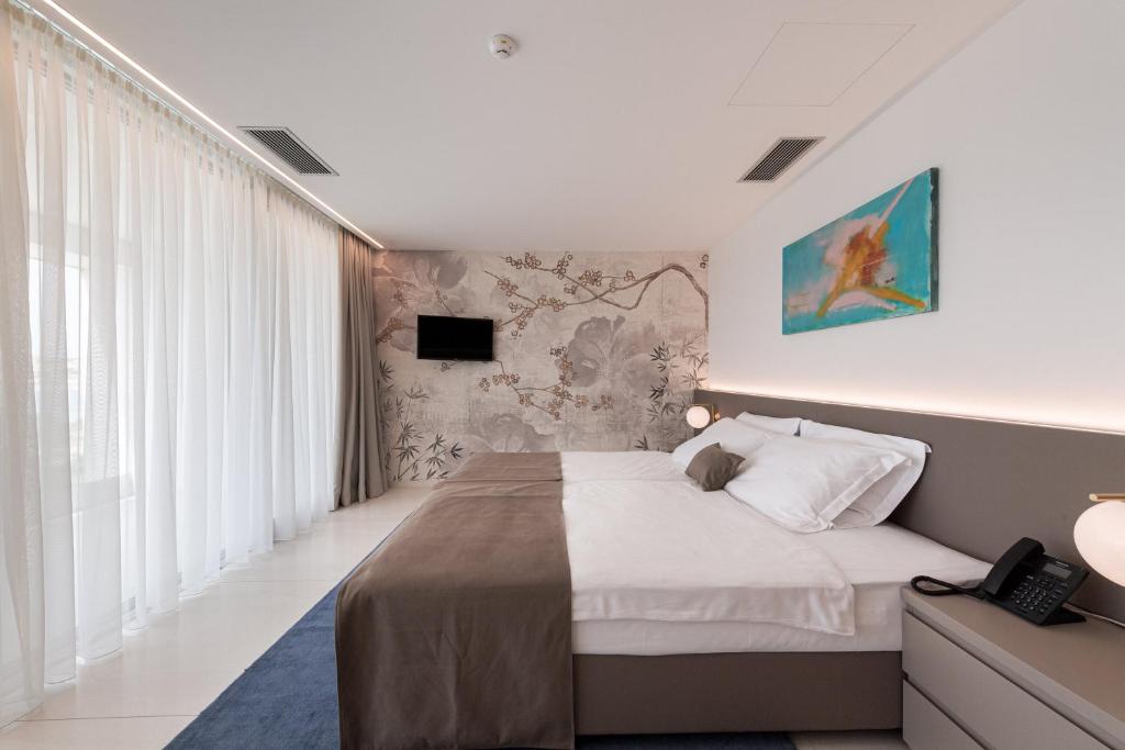 TV a/nebo společenská místnost v ubytování Aparthotel Joel