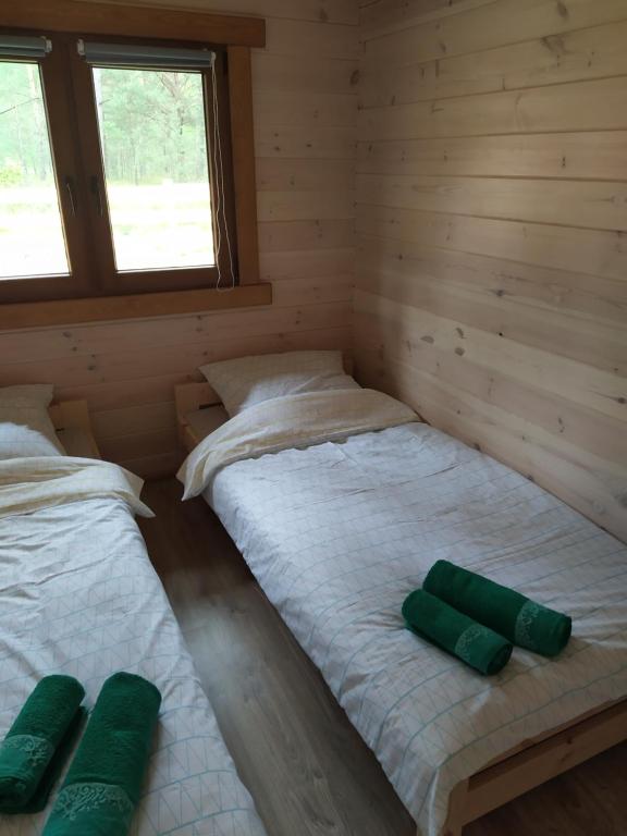 Posteľ alebo postele v izbe v ubytovaní Lesne Runo Borsk
