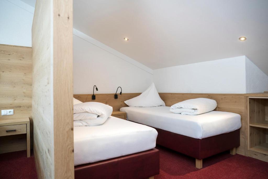 Postel nebo postele na pokoji v ubytování Aparthotel Schindlhaus und Koia Premium Apartments