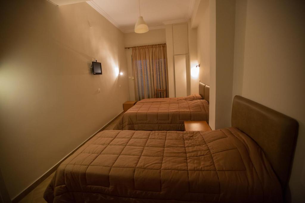Postel nebo postele na pokoji v ubytování Hotel Niki