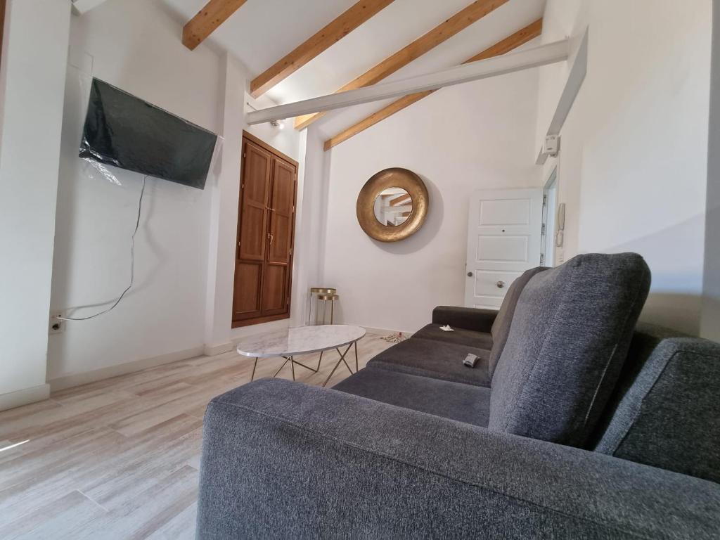 TV a/nebo společenská místnost v ubytování GLORIA SUITES