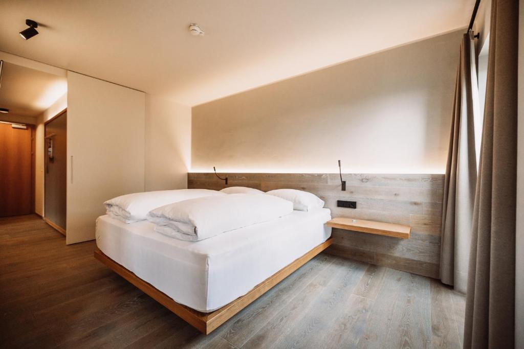 Postel nebo postele na pokoji v ubytování Weinhotel Maitz Wolfgang