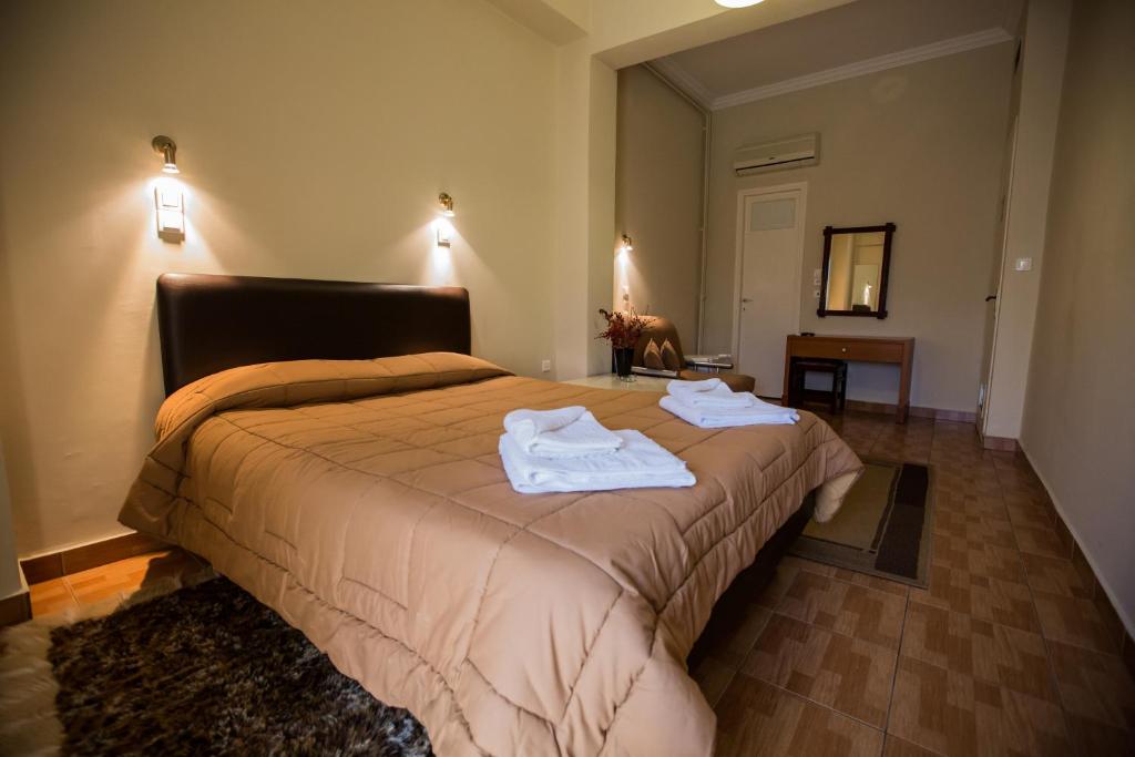 Postel nebo postele na pokoji v ubytování Hotel Niki