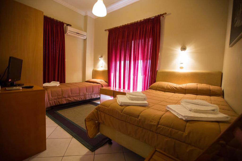 Postel nebo postele na pokoji v ubytování Hotel Niki